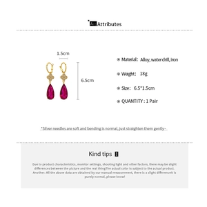 Detail view of flower drop earrings with red crystal showing dimensions 6.5x1.5cm