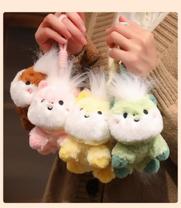 Detail of plush pony charms in pink, yellow, green and brown with soft woven lanyards