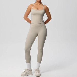 Detailed view of beige two-piece yoga set with racerback top and high waist leggings