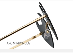 Detail of golden metal hinge and rimless black flame lens on trendy sunglasses