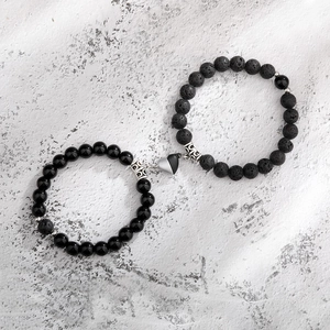Detail of magnetic heart clasp connecting obsidian and lava stone couples bracelets