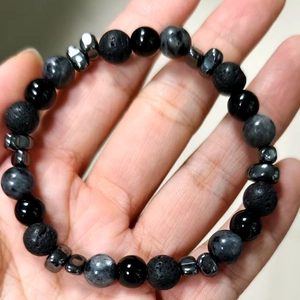 Men's 8mm beaded bracelet featuring lava stone and obsidian beads on a wrist