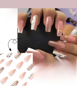 Macro shot of French coffin fake nails with marble patterns and rose gold glitter accents