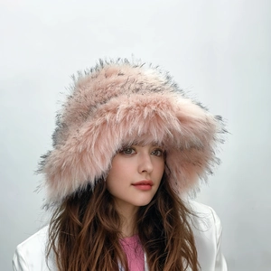 Detailed close-up of fluffy pink faux fur bucket hat with black tips and thick texture
