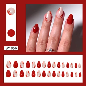 Red flower almond press-on nails with white leaf patterns and glossy finish set