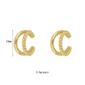 Detail of 13mm gold double-layered ear cuffs with twisted rope design and smooth finish