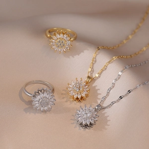 Close-up of sparkling rhinestone sunflower jewelry set on champagne silk fabric background