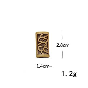 Macro view of vintage bronze hollow cylinder bead with 2.8cm height for hair styling