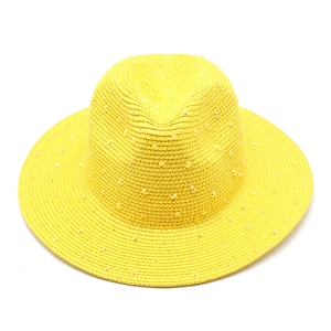 Detailed close-up of yellow straw Panama hat with sparkling rhinestone embellishments