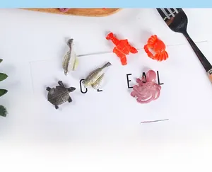 Top-down view of PVC ocean seafood miniatures including lobster, crab and turtle