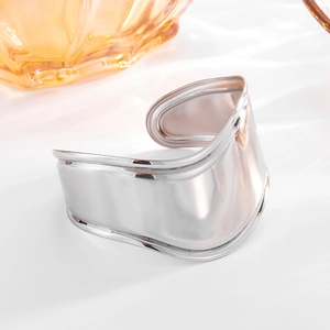 Elegant wavy silver open C-shaped cuff bracelet made of polished 18k plated titanium steel