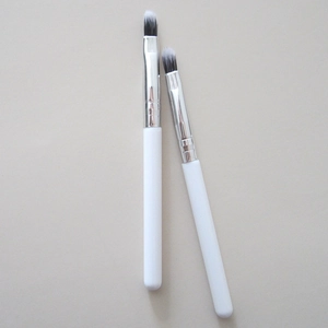 Detail of round head silicone lip brushes with silver ferrules for blending concealer