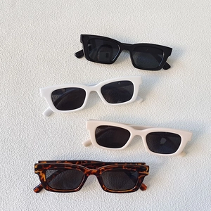 Retro rectangle sunglasses in black, white, beige, and tortoiseshell displayed on a white background