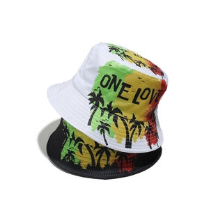 Detail showing One Love text and palm tree silhouettes on reggae style bucket hats