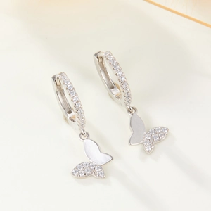 Macro shot of S925 sterling silver butterfly earrings with micro-pave zirconia stones