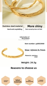 Detailed macro view of 18K gold plated stainless steel cuff with hammered thorn texture
