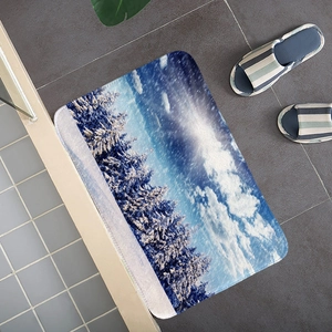 Detail view of snowy forest pattern on a non-slip flannel mat with rounded edges