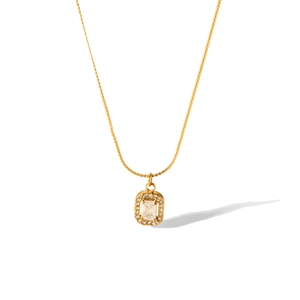 Macro detail of 18K gold stainless steel necklace with a sparkling rectangle pendant