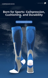 Detail view of compression socks with arch support and cushioned heel in blue and grey