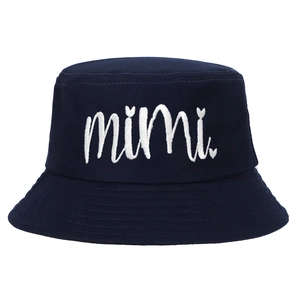 Close-up of navy cotton bucket hat with white mimi heart embroidery and high texture