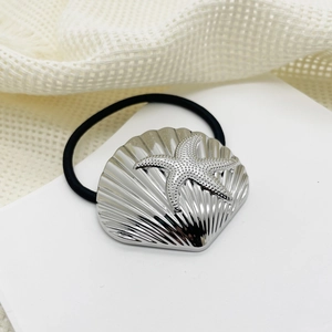 Detail of eco-friendly alloy hair tie with silver shell and starfish charms on black cord