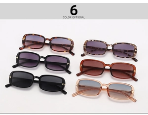 Detail of six vintage rectangular sunglasses with gold T-shaped metal hinges on temples