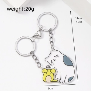 Detail of cat and hamster acrylic couple keychains with heart-shaped magnetic connection
