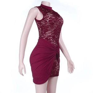 Detail of burgundy lace patchwork and twist pleated waist on slim fit bodycon dress