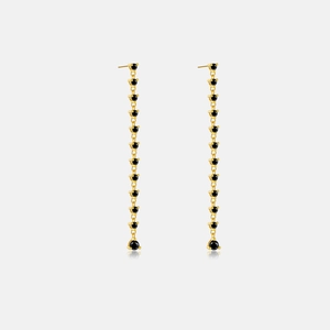 Detailed view of long gold fringe earrings with multiple black round zircon stones