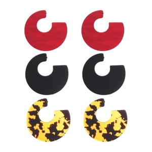 Three pairs of C-shaped acrylic hoop earrings in red, black, and leopard print style
