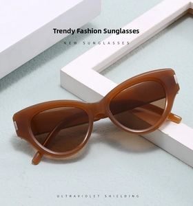 Detail of tortoiseshell cat-eye sunglasses with silver metal accents and UV lenses
