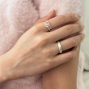 Minimalist 925 sterling silver ring set with matte texture and irregular twisted design