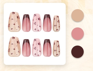 Detailed view of leopard print and French tip press-on nails in coffin shape set