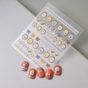 Detail of 5D embossed nail stickers featuring cute rabbits and vintage floral frames