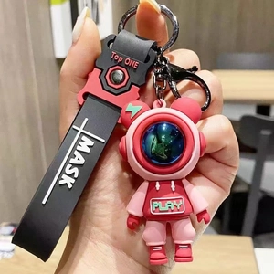 Rosa Astronaut Schlüsselanhänger mit Mask-Schriftzug und schwarzem Silikonband für Taschen