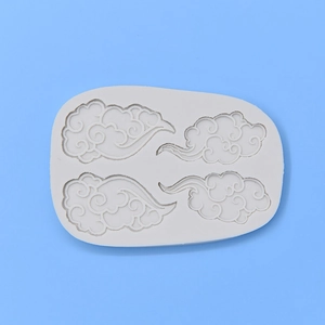 White silicone cloud mold for baking cakes or handmade soap on a light blue background
