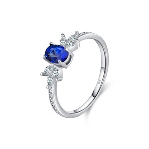 Elegant S925 sterling silver ring featuring a blue oval gemstone and sparkling accents