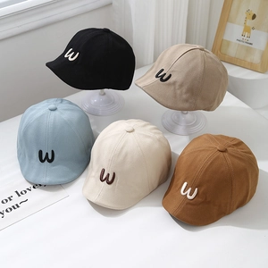 Minimalist cotton baby beret hats with W embroidery in five classic assorted colors