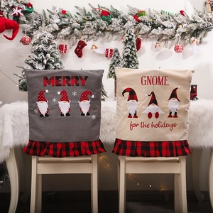 Christmas gnome chair covers with red plaid pleated skirts and festive embroidery