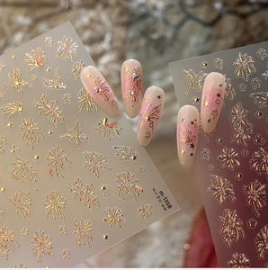 Macro shot of M-1358 golden fireworks nail stickers with stars and butterfly patterns