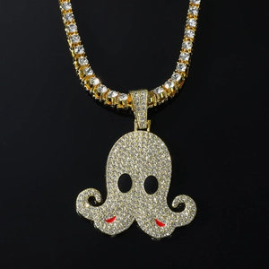 5mm golden tennis chain with a full crystal-encrusted cartoon octopus pendant on black background