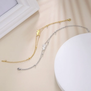 Detail of cute cat charms on gold and silver stainless steel double beaded bracelets