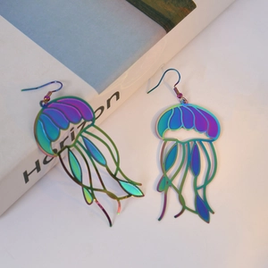 Detailed view of colorful laser jellyfish earrings with intricate hollowed-out tentacles