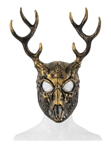 Detail of bronze ram bone mask with deer horns and sun relief engraving for cosplay