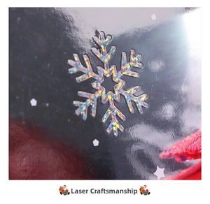 Detail of 3D Christmas card showing holographic laser snowflake and red plush texture