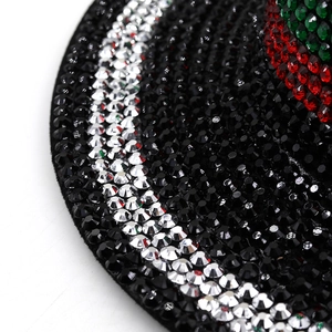 Macro shot of silver rhinestones and luxury diamond detailing on the black wool jazz hat