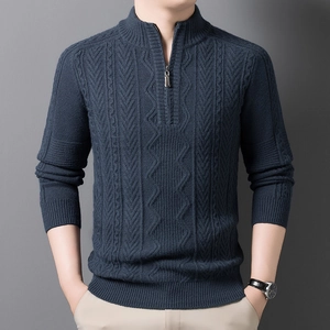 Detailed view of men's navy blue quarter-zip cable knit sweater with textured collar