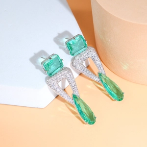 Elegant geometric S925 silver earrings with mint green teardrop stones and cubic zirconia