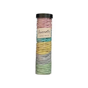 Elastic spiral hair ties set in five colors inside a transparent cylindrical gift box