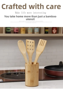 Close-up of bamboo kitchen utensil set with slotted turner and cylindrical holder